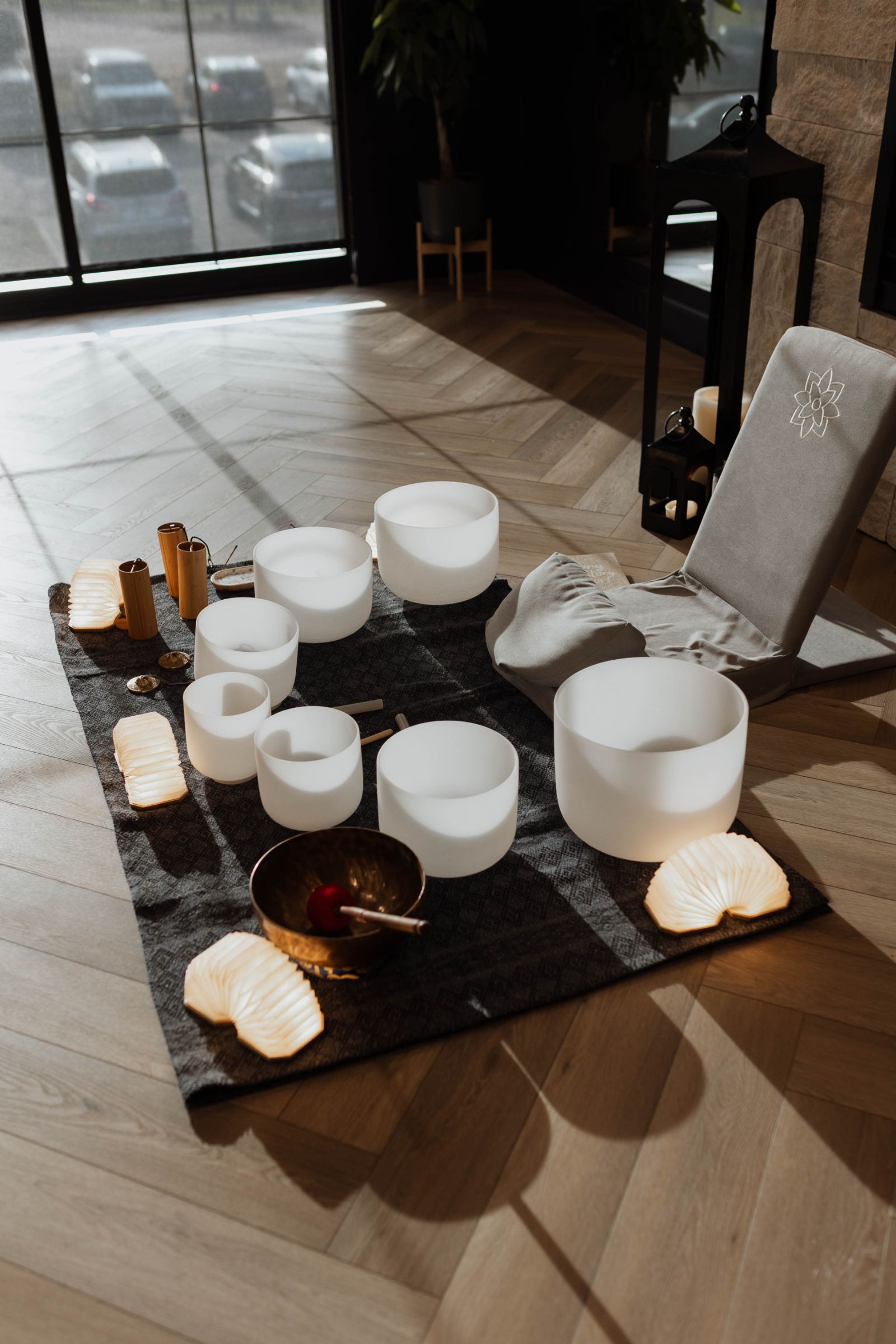Sound bowls set for a private session by the studio windows